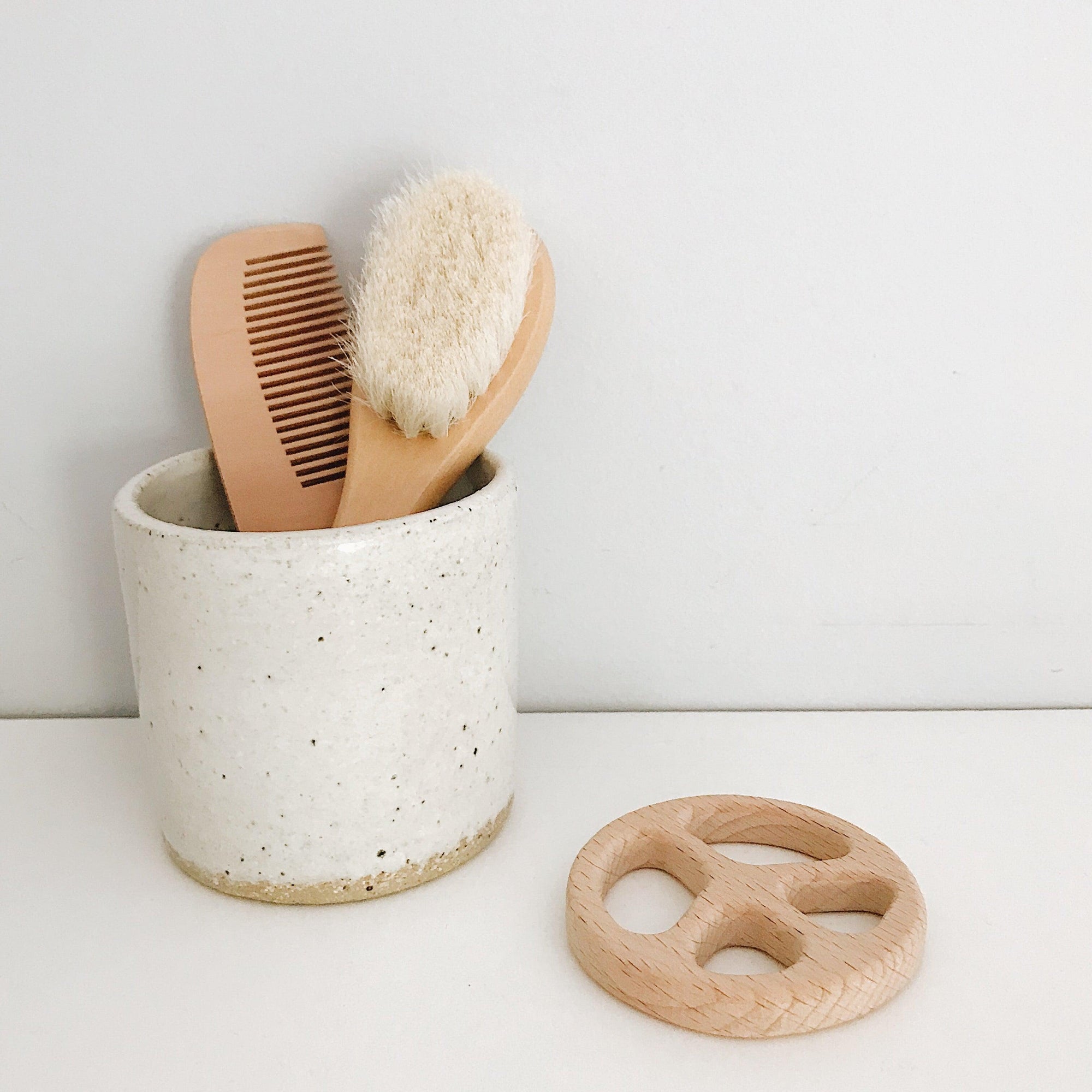 Our gorgeous Hair Brush & Comb Set is super soft. Perfect for your baby's delicate crown. Both the brush and comb have curved, wooden handles for easy and comfortable grip.