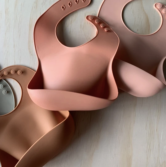 Rommer bibs are made from the softest silicone. They are both lightweight and durable. Rommer has updated the bib design to feature the reinforced button holes making them more resistant to tears.