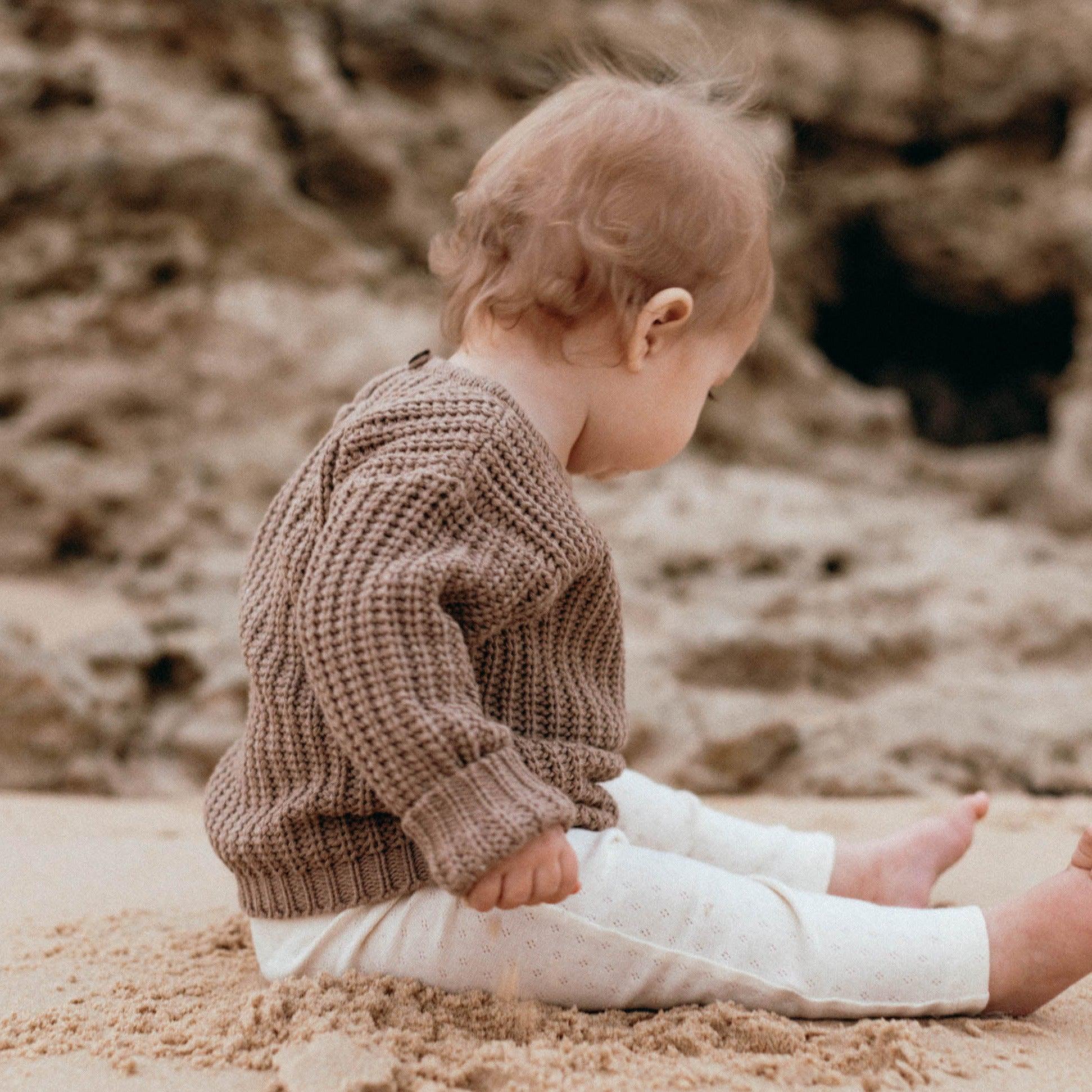 The Zoa knit is lovingly handmade using a loom which is a tool that is guided by the hand. 100% soft cotton, teardrop fastening at back with wood button. Good amount of stretch, considered true to size described as more ‘fitted’.