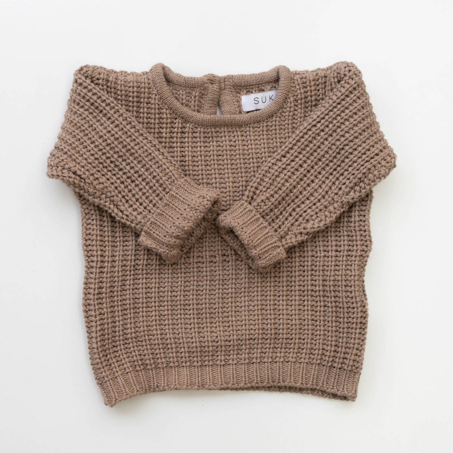 The Zoa knit is lovingly handmade using a loom which is a tool that is guided by the hand. 100% soft cotton, teardrop fastening at back with wood button. Good amount of stretch, considered true to size described as more ‘fitted’.