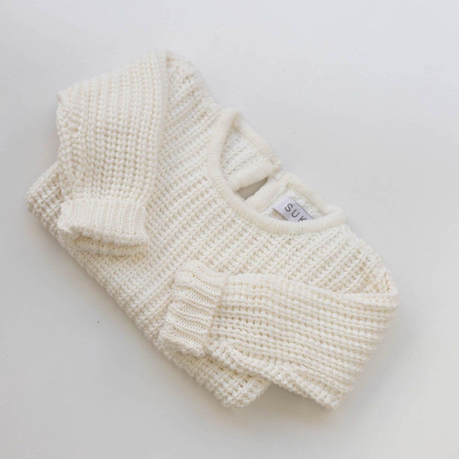 The Zoa knit is lovingly handmade using a loom which is a tool that is guided by the hand. 100% soft cotton, teardrop fastening at back with wood button. Good amount of stretch, considered true to size described as more ‘fitted’.