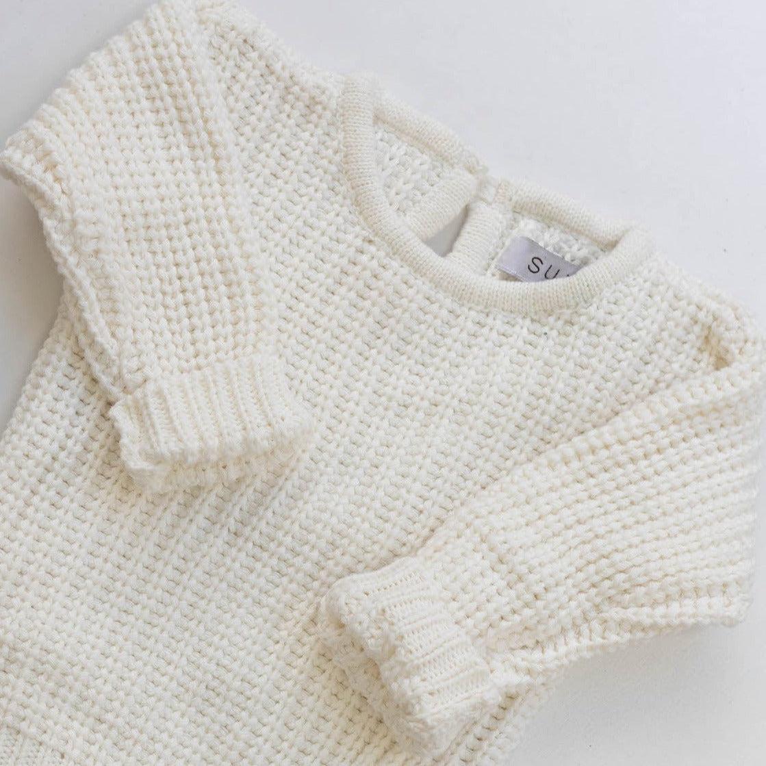 The Zoa knit is lovingly handmade using a loom which is a tool that is guided by the hand. 100% soft cotton, teardrop fastening at back with wood button. Good amount of stretch, considered true to size described as more ‘fitted’.