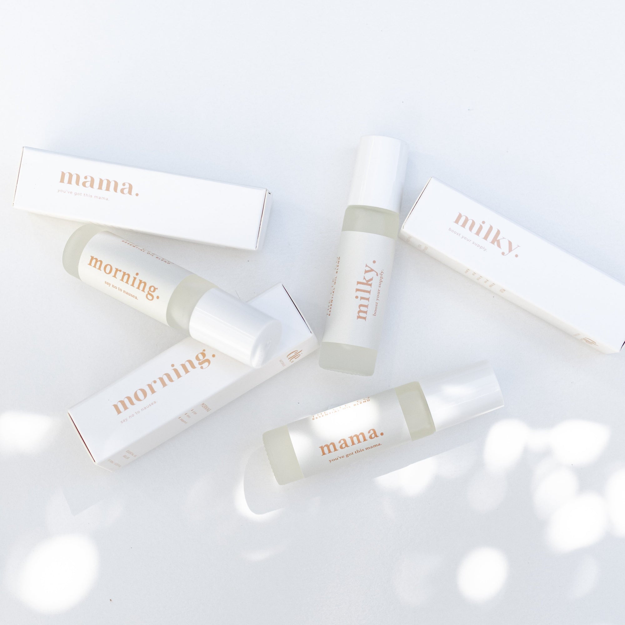 A selection of Clē Naturals essential oils on a white surface.