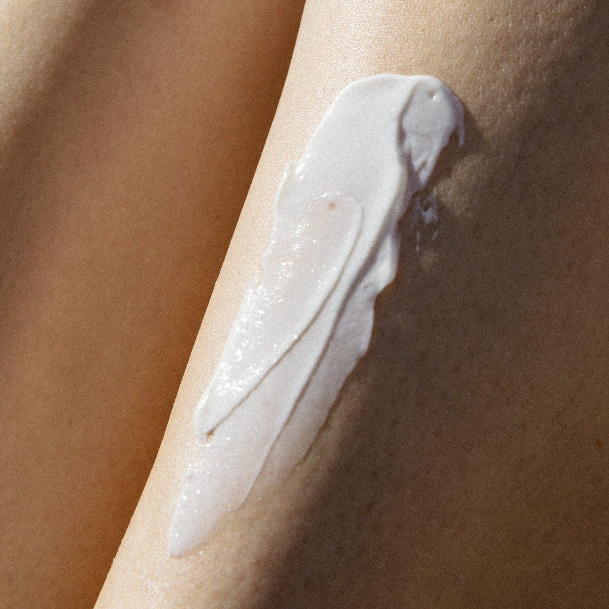 A woman's leg with Wiley Body's organic aloe vera cream from the Wiley Body Bundle on it.